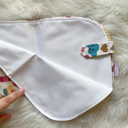 Unicorn changing mat unfolded showing waterproof side
