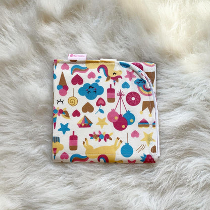 Unicorn changing mat folded to palm size
